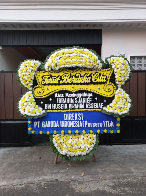 Papan Bunga Duka di Giring