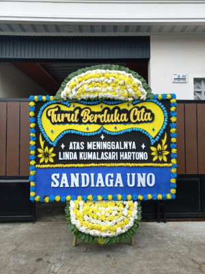 Papan Bunga Duka di Giring